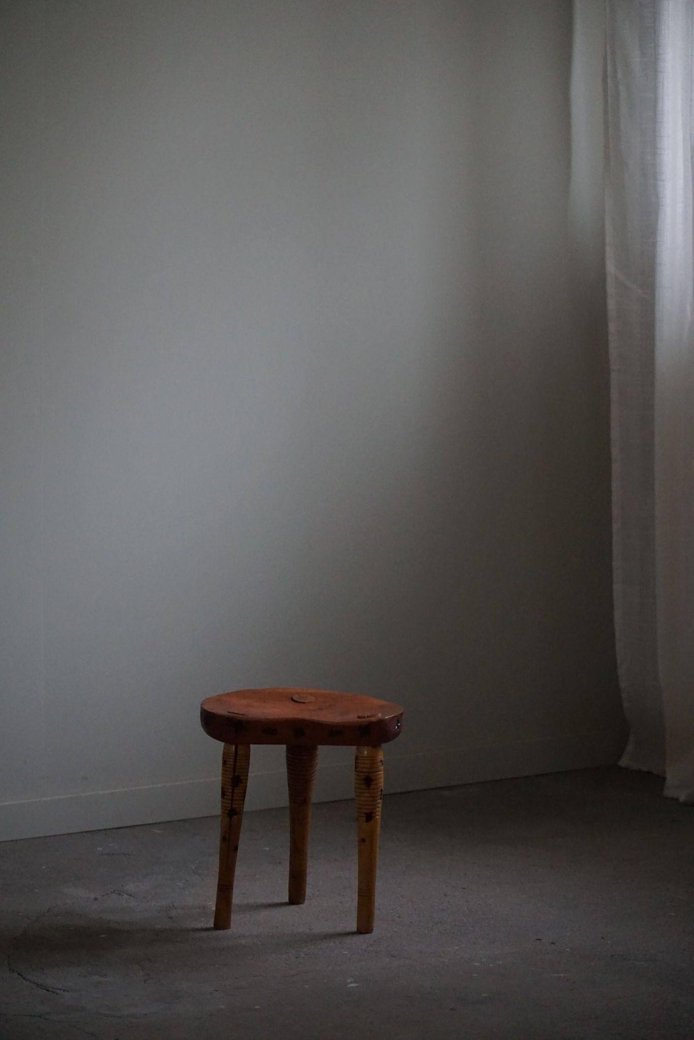 Primitive tripod stool in solid pine, modern Swedish style, from the 1950s.