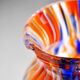 Small antique art deco cobalt orange speckled glass paste vase