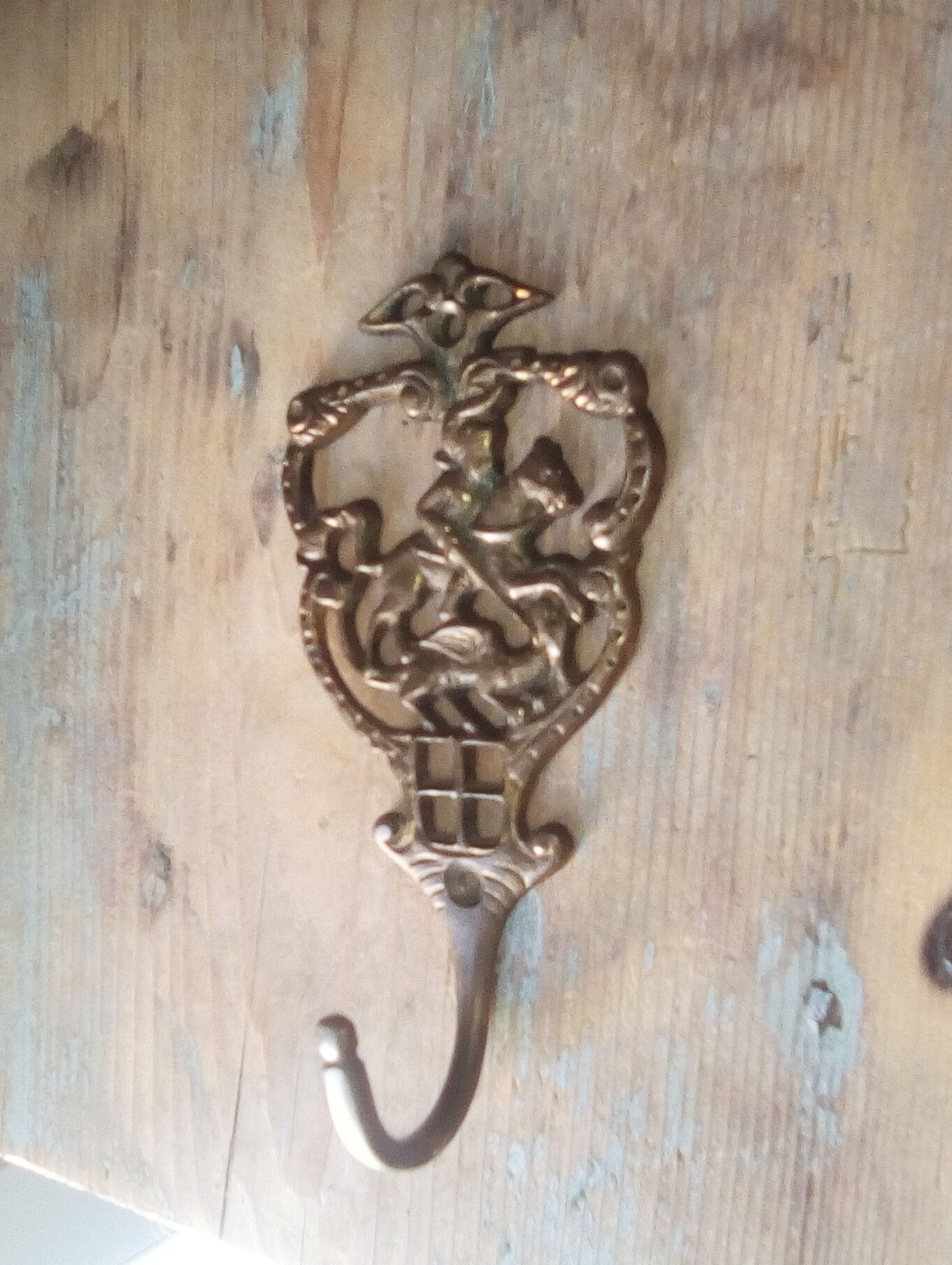 Old brass patère coat rack