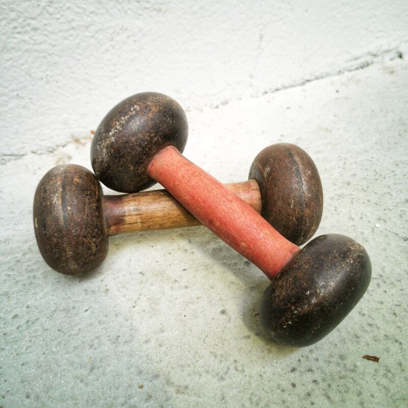 Pair of vintage dumbbells in cast iron and wood