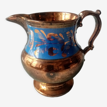 Old jarsey earthenware pitcher with irises reflections and royal blue band