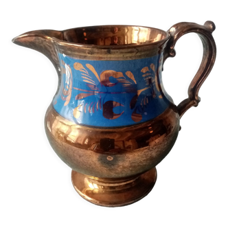Old jarsey earthenware pitcher with irises reflections and royal blue band