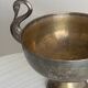 Large champagne bucket with patinated metal swan handles.