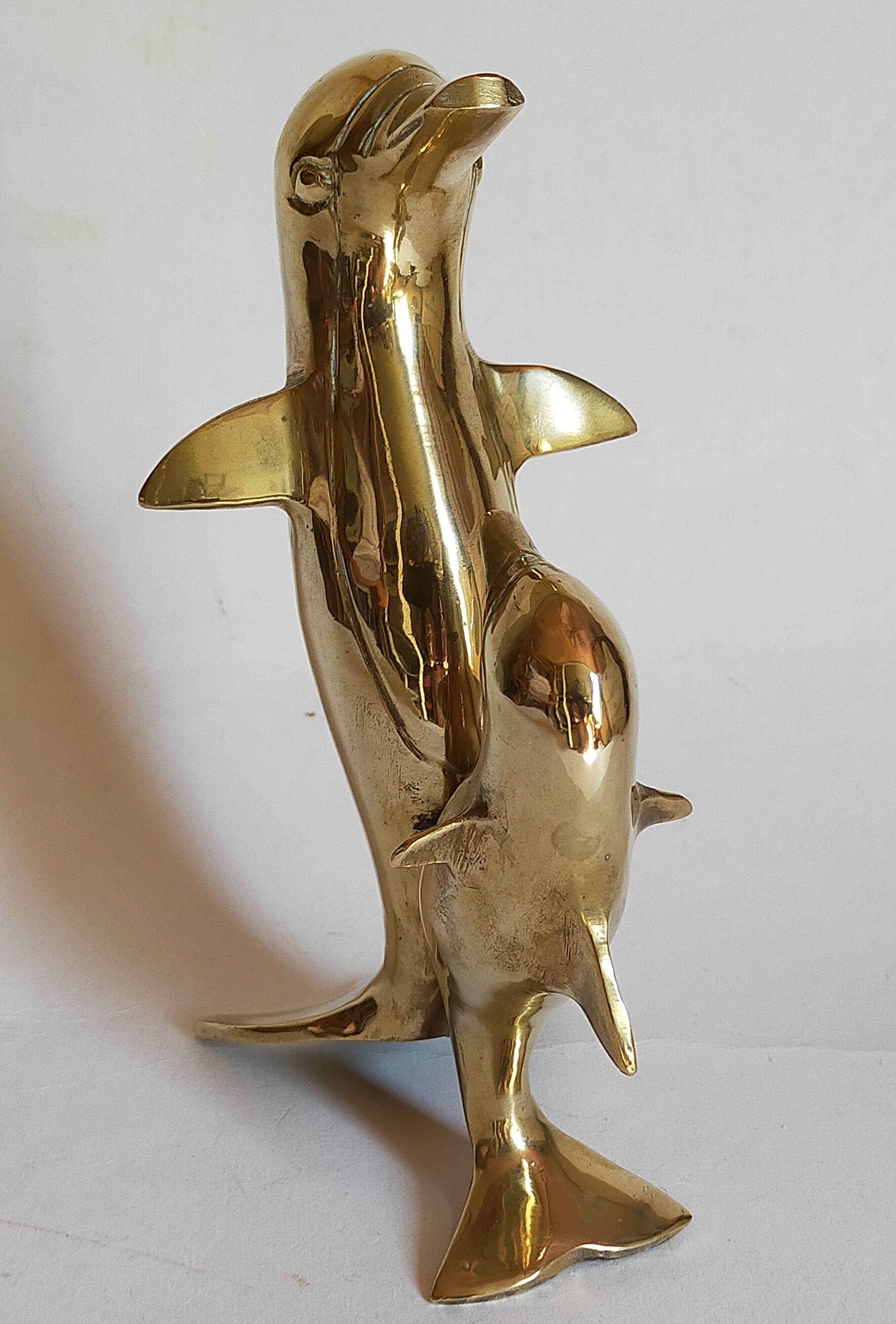 Vintage solid brass dolphins
