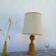 Old turned wooden lamp
