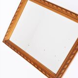 Small old wooden mirror with carved frame