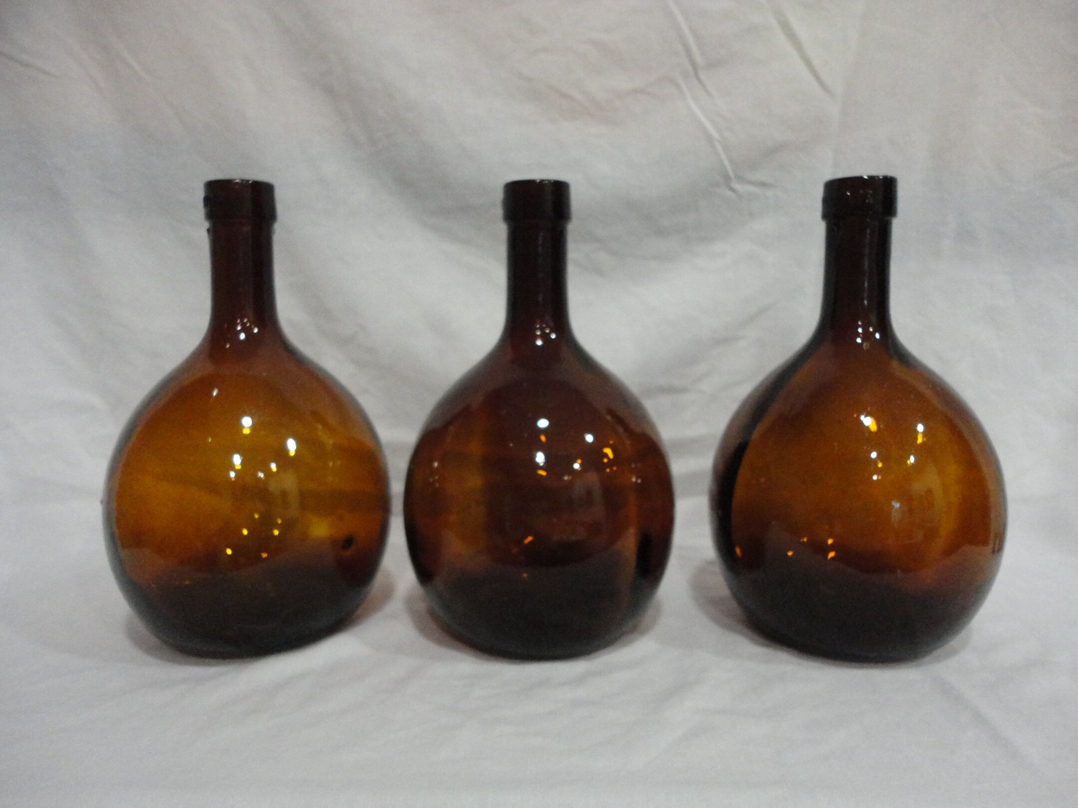 Lot 3 old round bottles