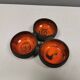 Beautiful bowl (composed of 3 bowls) with orange/red glaze inside