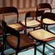 Suite de 6 chaises traineau Baumann cannées vintage