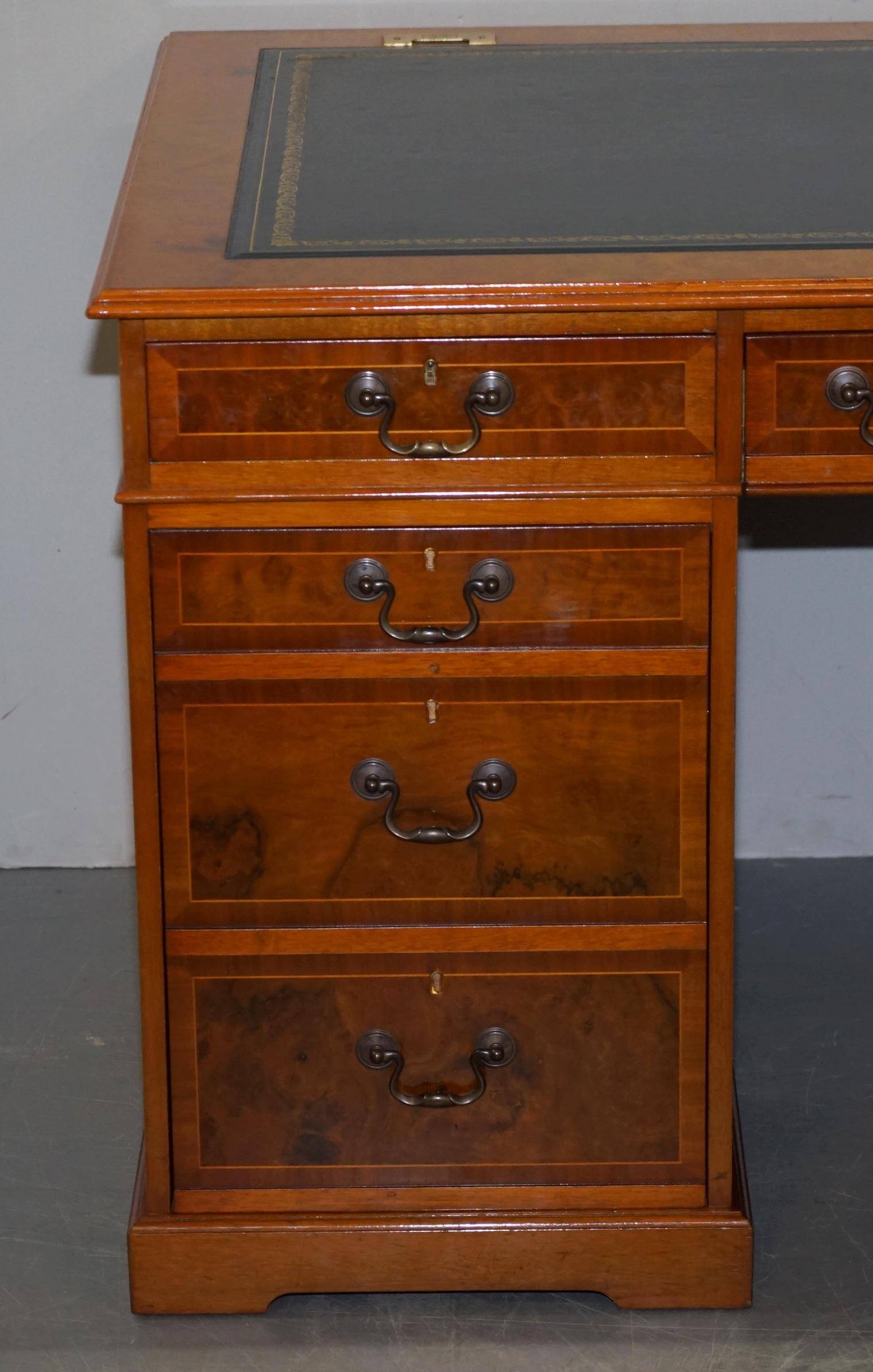 Partner desk in burr walnut designed to conceal computer equipment.