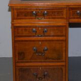 Partner desk in burr walnut designed to conceal computer equipment.