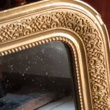 miroir ancien en bois et stuc doré