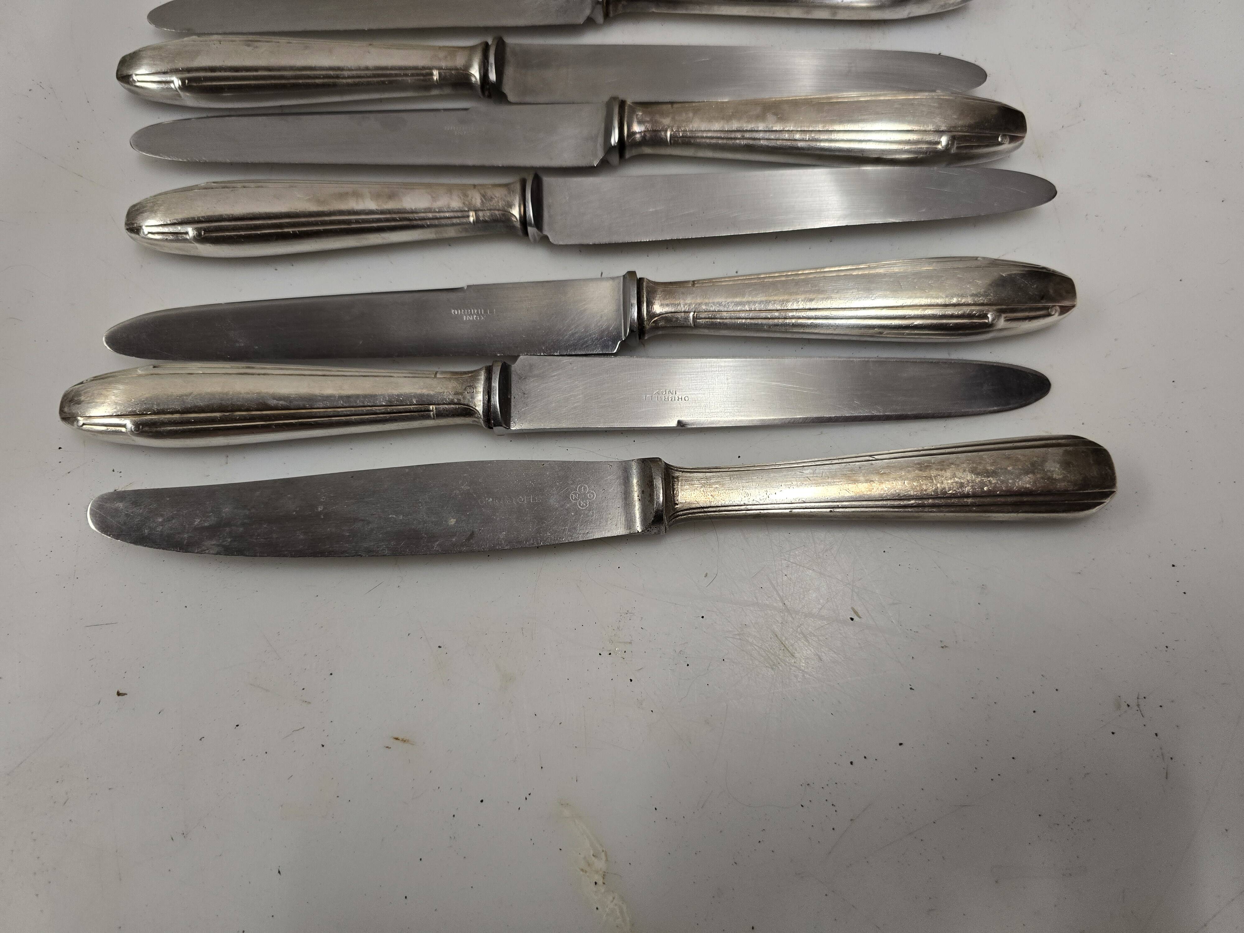12 silver-plated knives from the mid-20th century