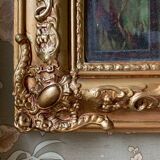 Miroir ancien en bois sculpté doré à décor de fleurs