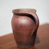 Pot in Norman sandstone of Ger