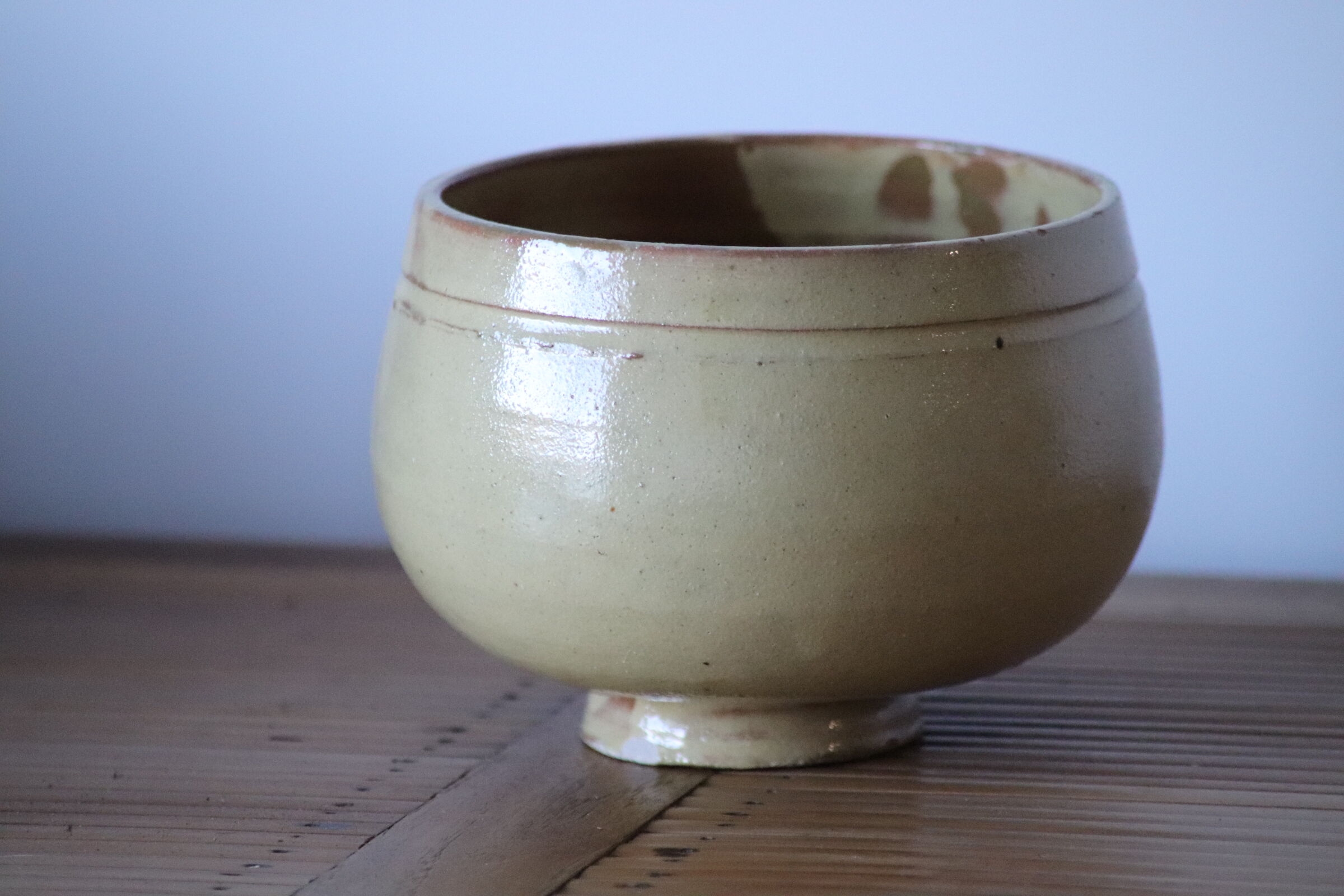 Ball vase in pale yellow glazed sandstone