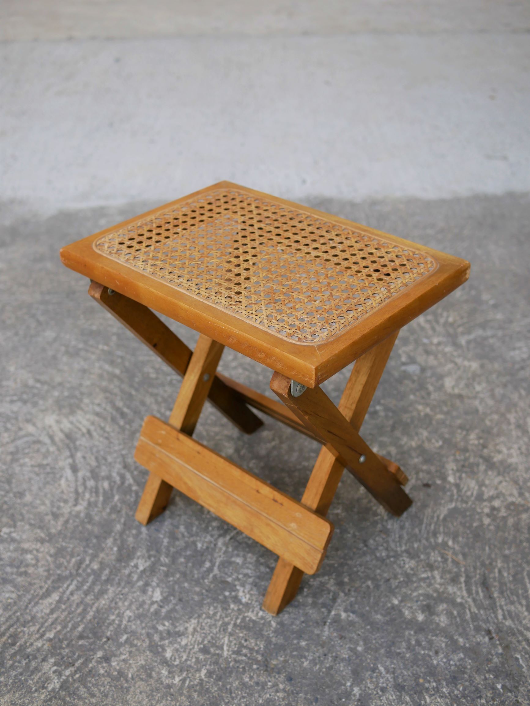Wooden stool and folding caning