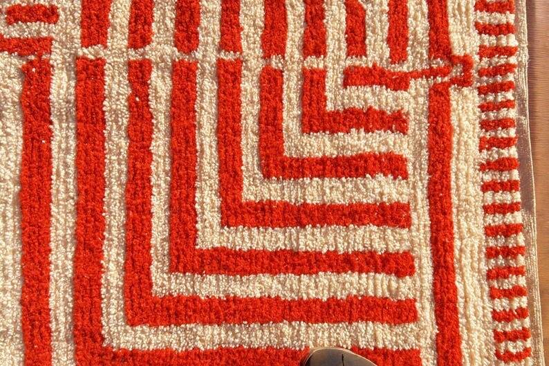 Handmade traditional orange and white Beni Ourain rug.