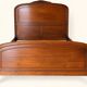 Double bed Louis XV carved walnut with roses and cabriole legs.
