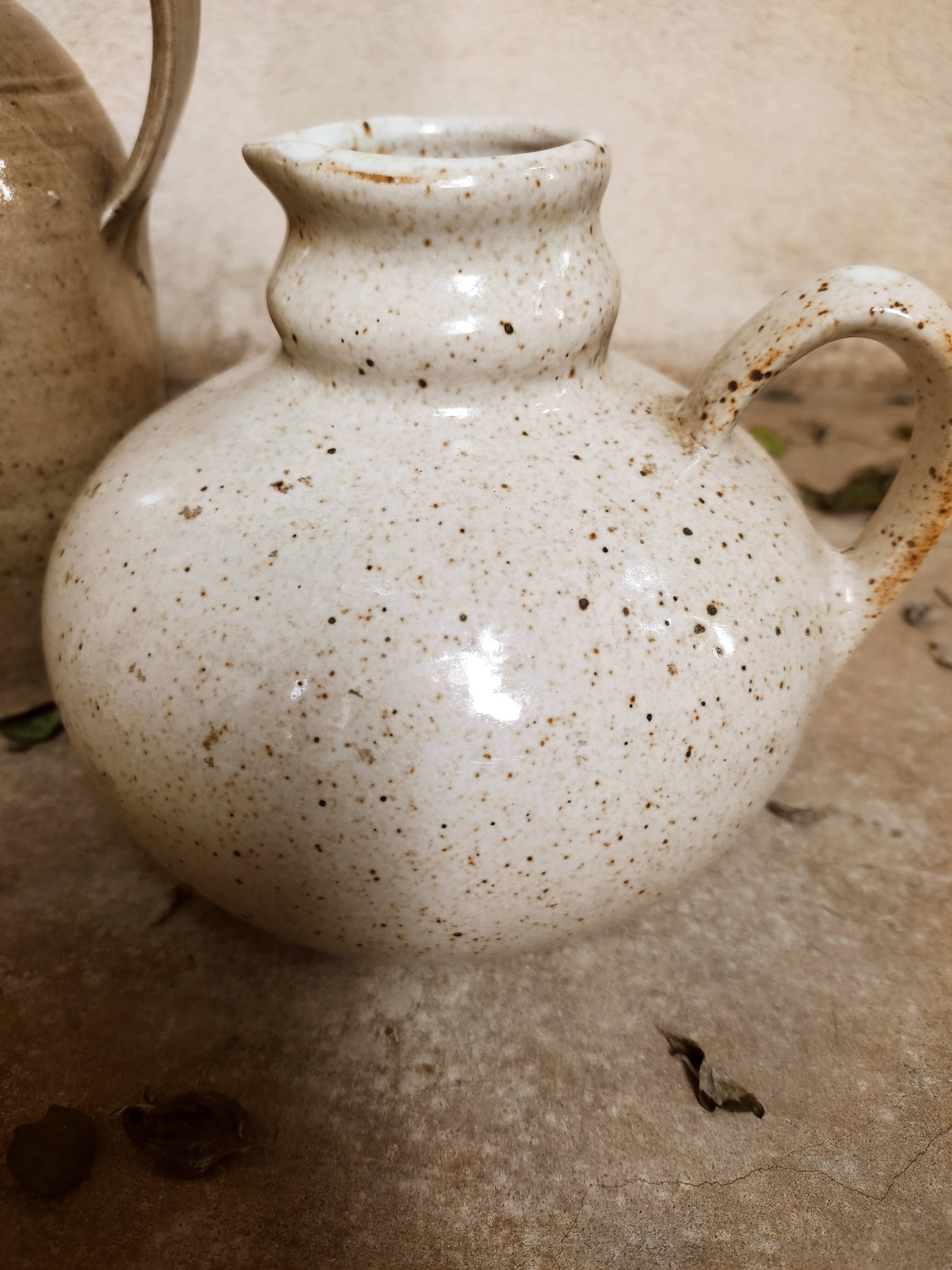 Stoneware decanters and candle holder