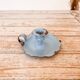 Blue enameled sheet metal candle holder