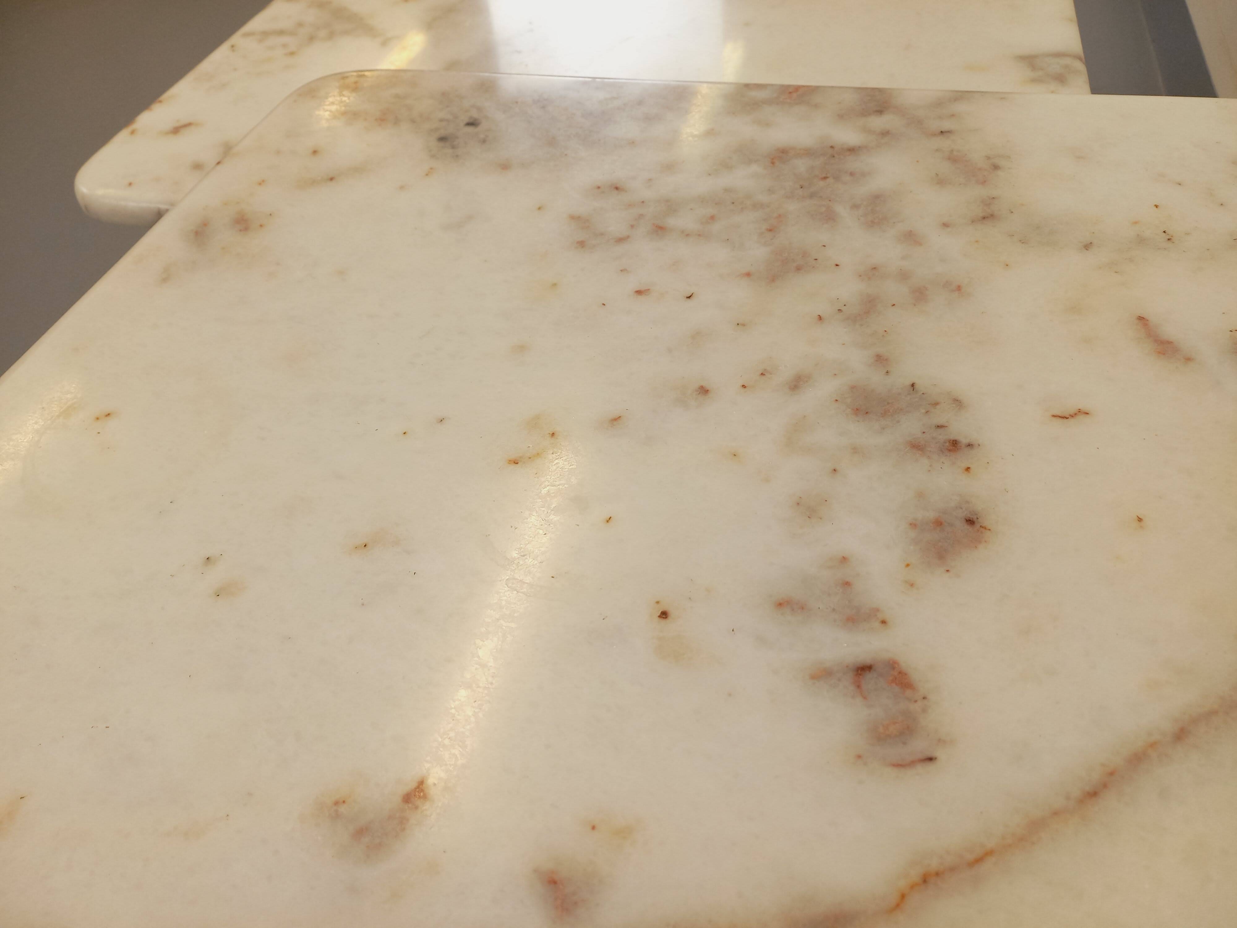 Pair of vintage nesting coffee tables in white marble from the 1970s.