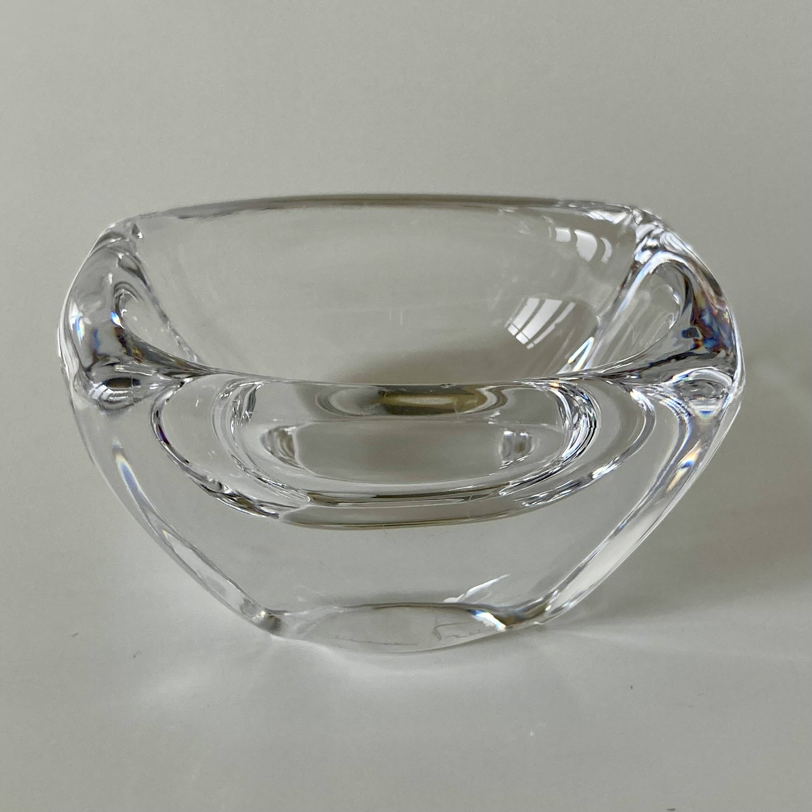Pair of colourless crystal salt shakers from the Daum Nancy house.