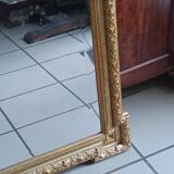 Antique mirror in wood and gilded stucco, neo Louis XVI style.