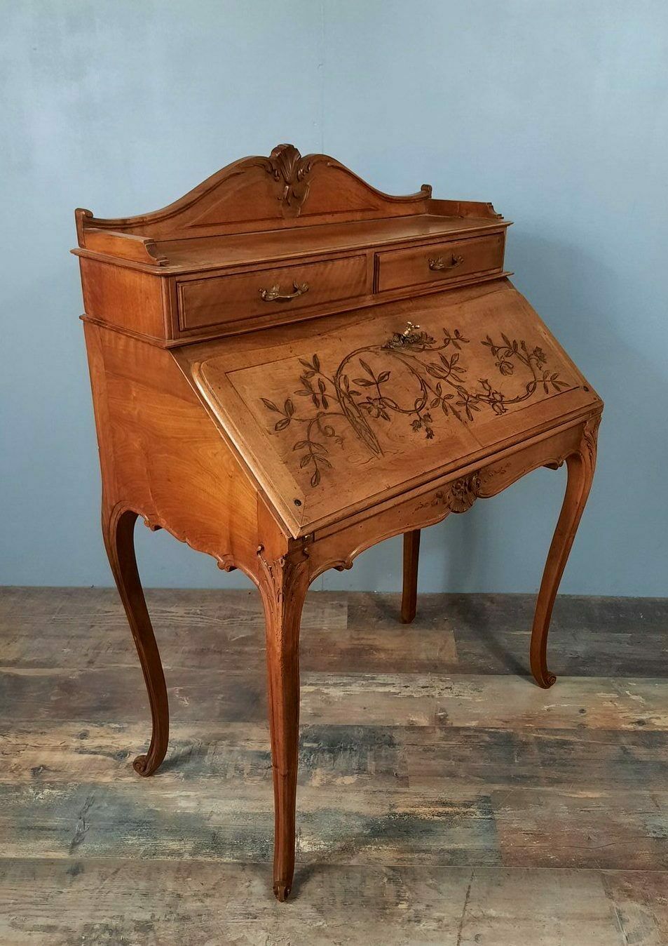 Louis XV style stepped donkey back desk in walnut in early 1900