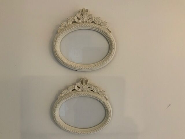 2 off-white oval plaster frames