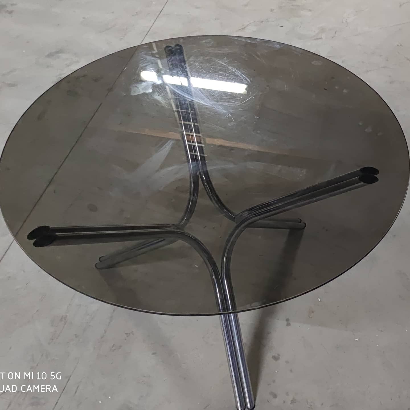 Tripod table in chrome steel and tray in smoked glass circa 1970