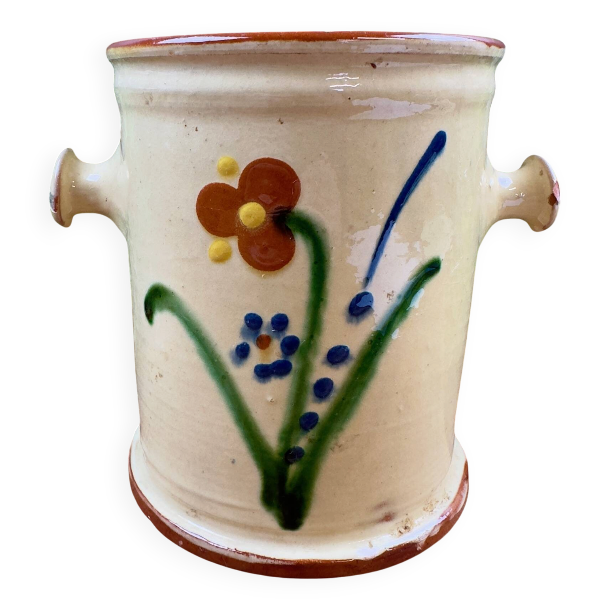 Antique ceramic pot with hand-painted floral decoration.