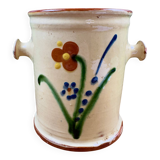 Antique ceramic pot with hand-painted floral decoration.