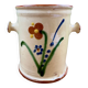 Antique ceramic pot with hand-painted floral decoration.