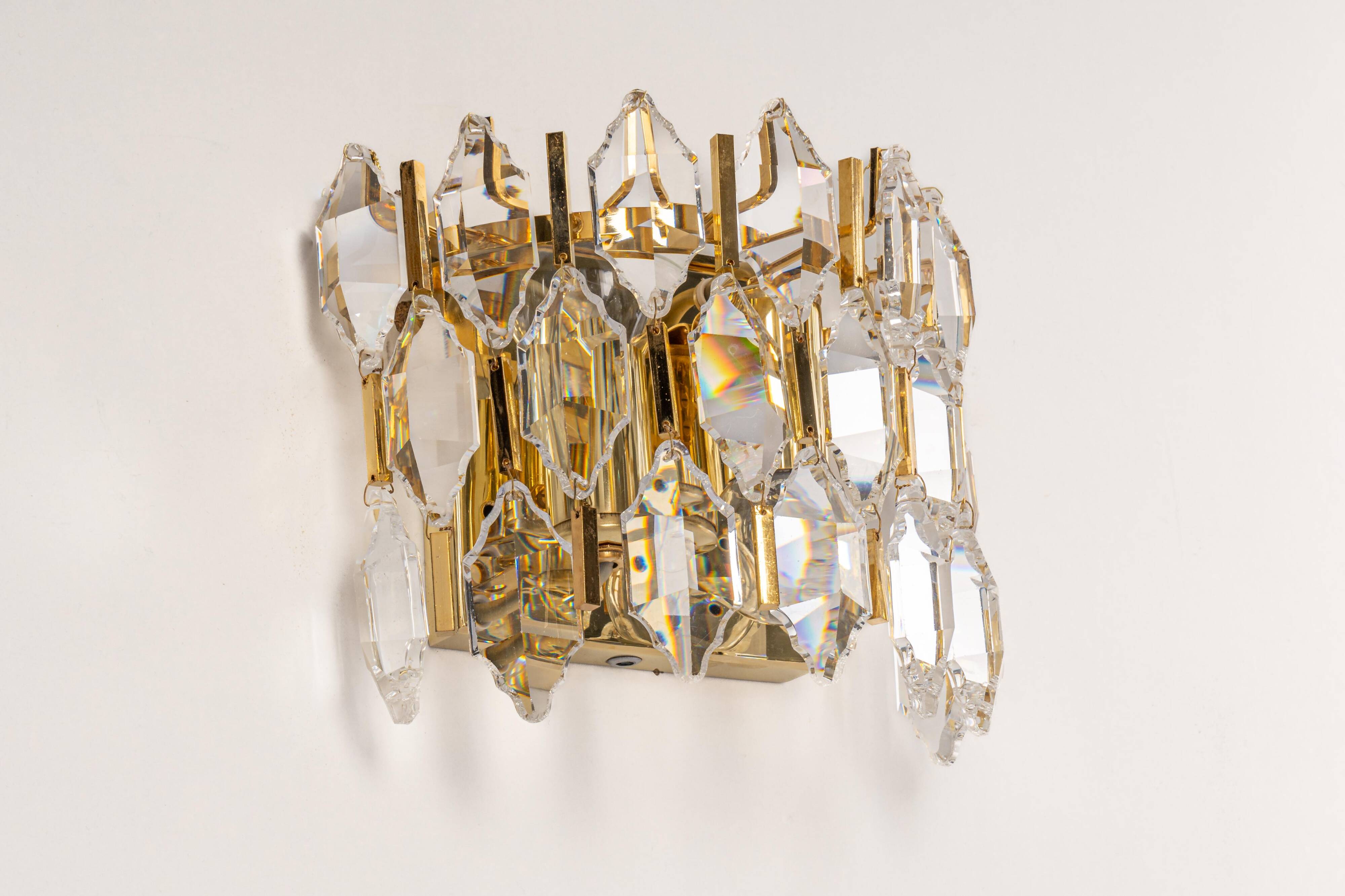Pair of wall sconces in gilded brass and crystal by Palwa, Germany, 1970s.