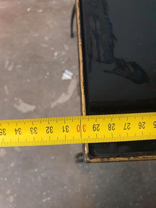 Vintage cast iron and black glass side table