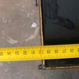 Vintage cast iron and black glass side table