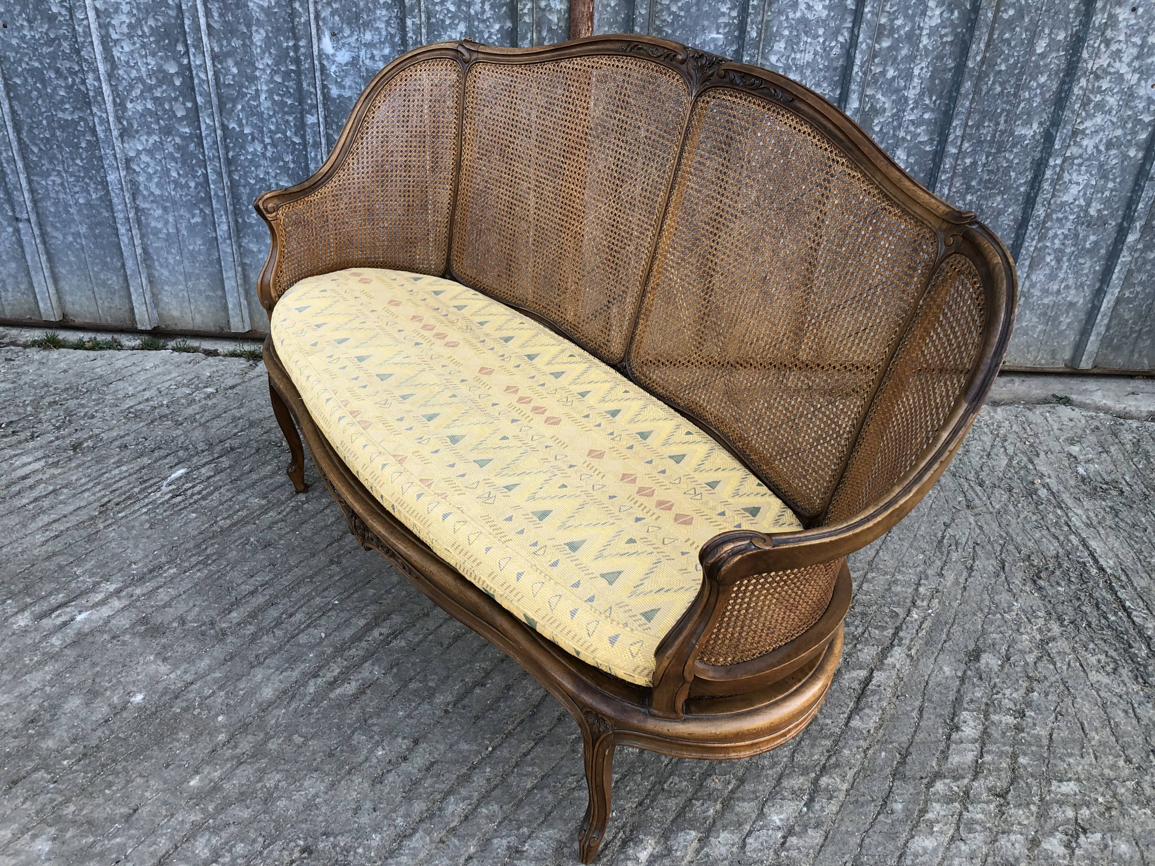 Antique Louis XV bench in solid walnut and caning