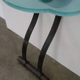 Artisanal wrought iron and cast glass leaning console table