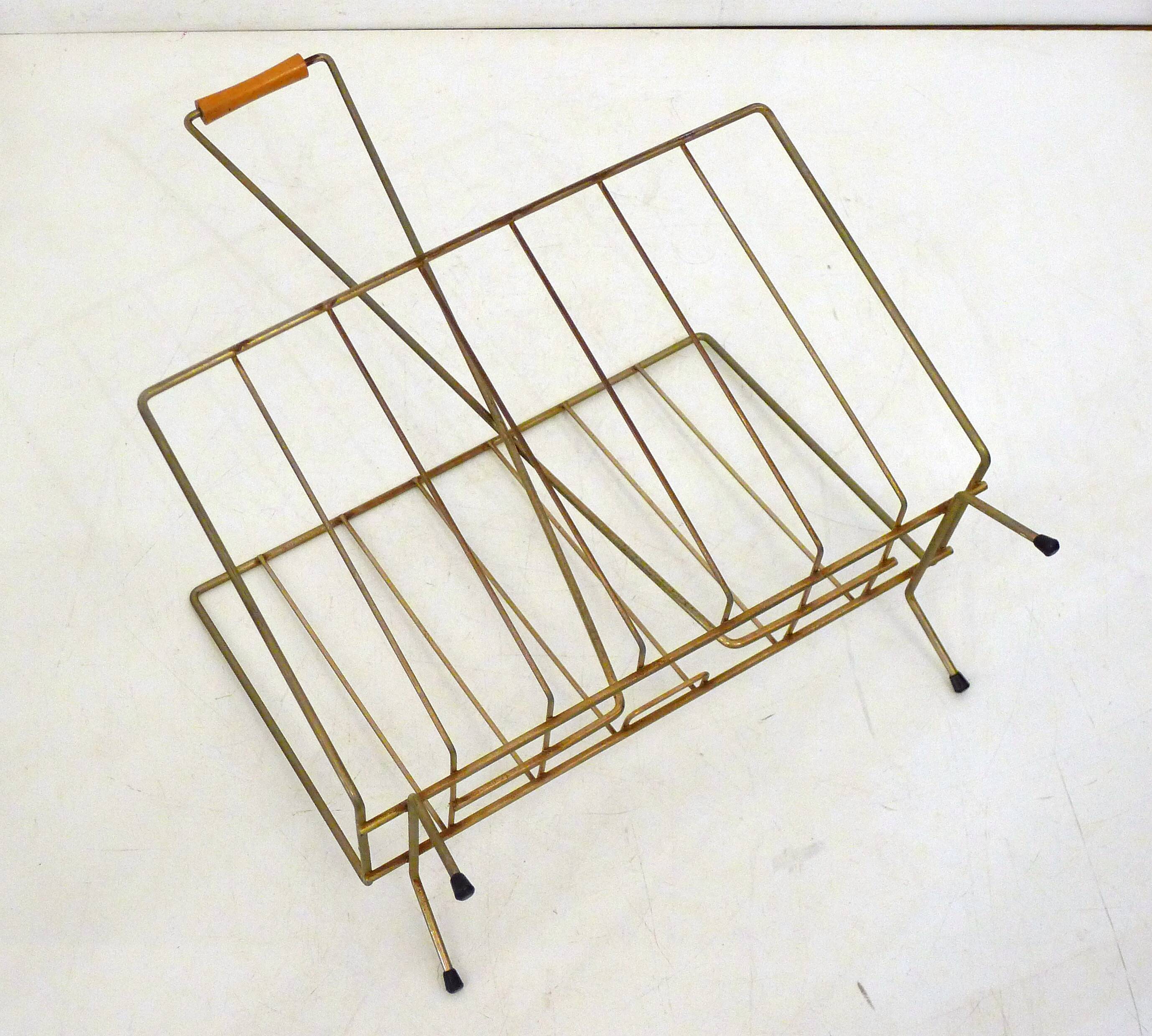 Mid-century openwork magazine rack, in gold metal & wooden handle.