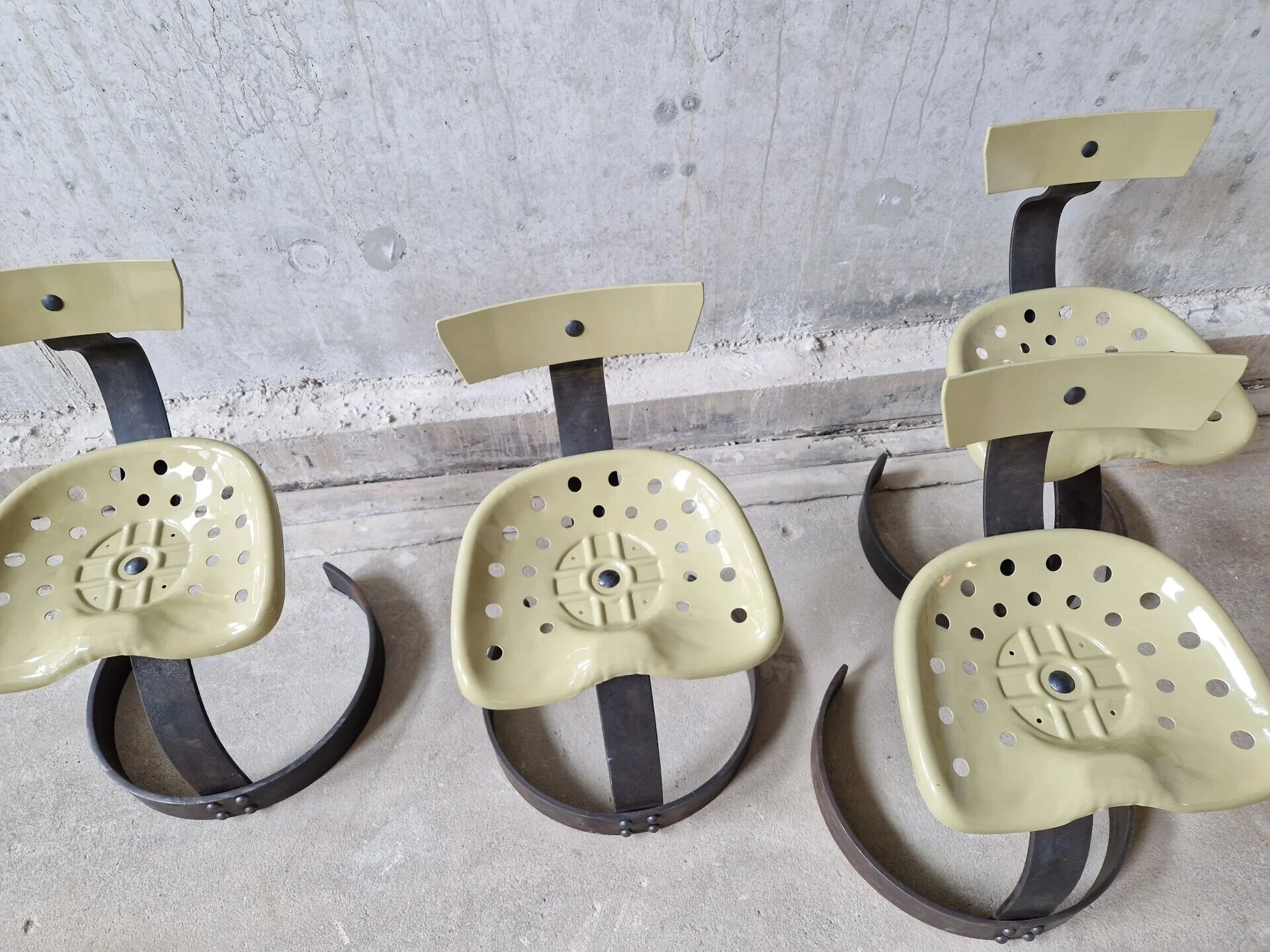 Unique set of 4 metal tractor seat chairs, 1990