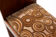 Rests art-deco feet in walnut