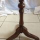 Round end table with tripod mast. 50 years. Medium oak color.