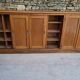 Oak workshop furniture with sliding doors.