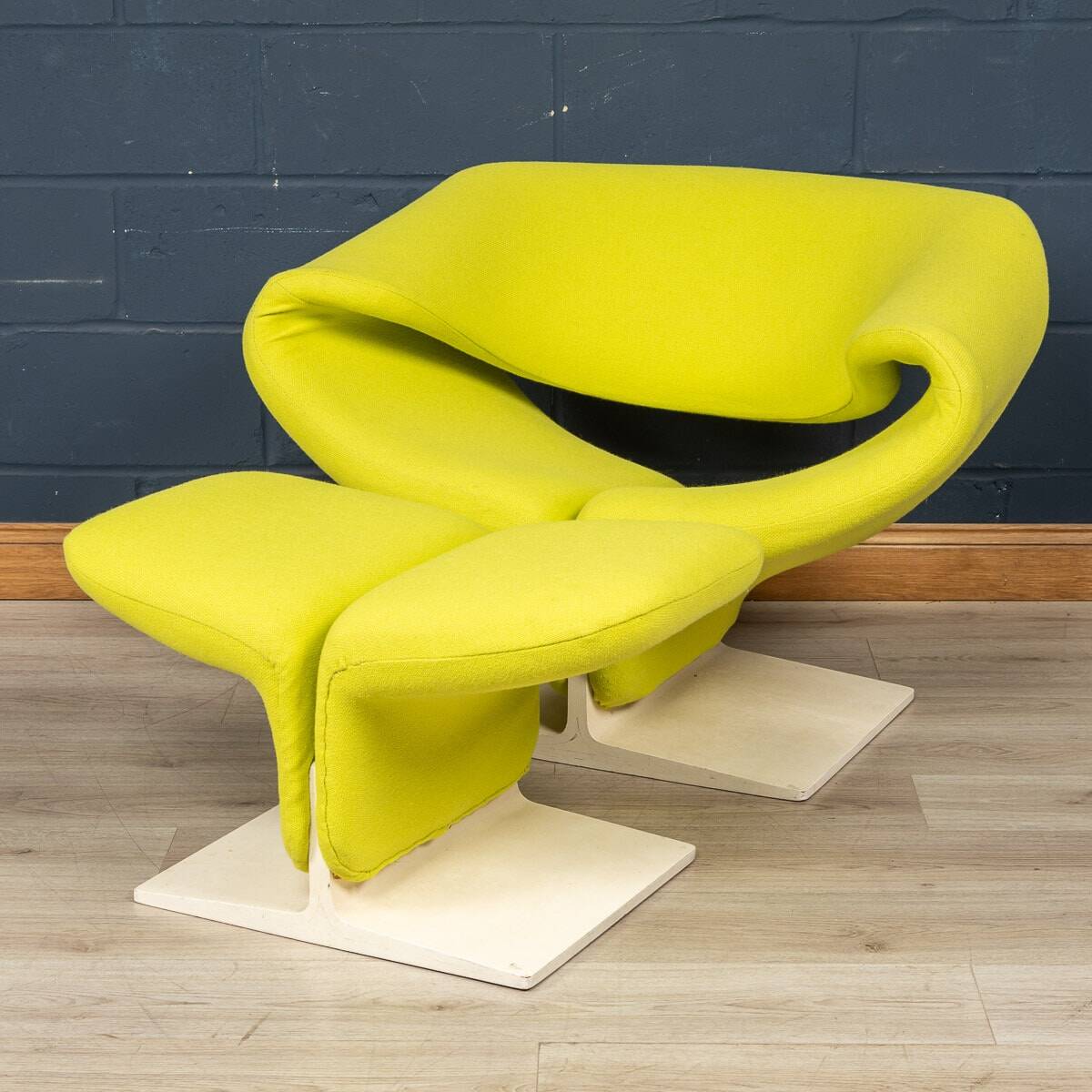 A 20thC RIBBON CHAIR & FOOTSTALL BY PIERRE PAULIN FOR ARTIFORT, FRANCE