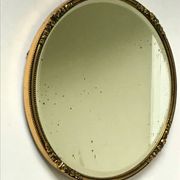 Miroir biseauté antique avec cadre en métal doré