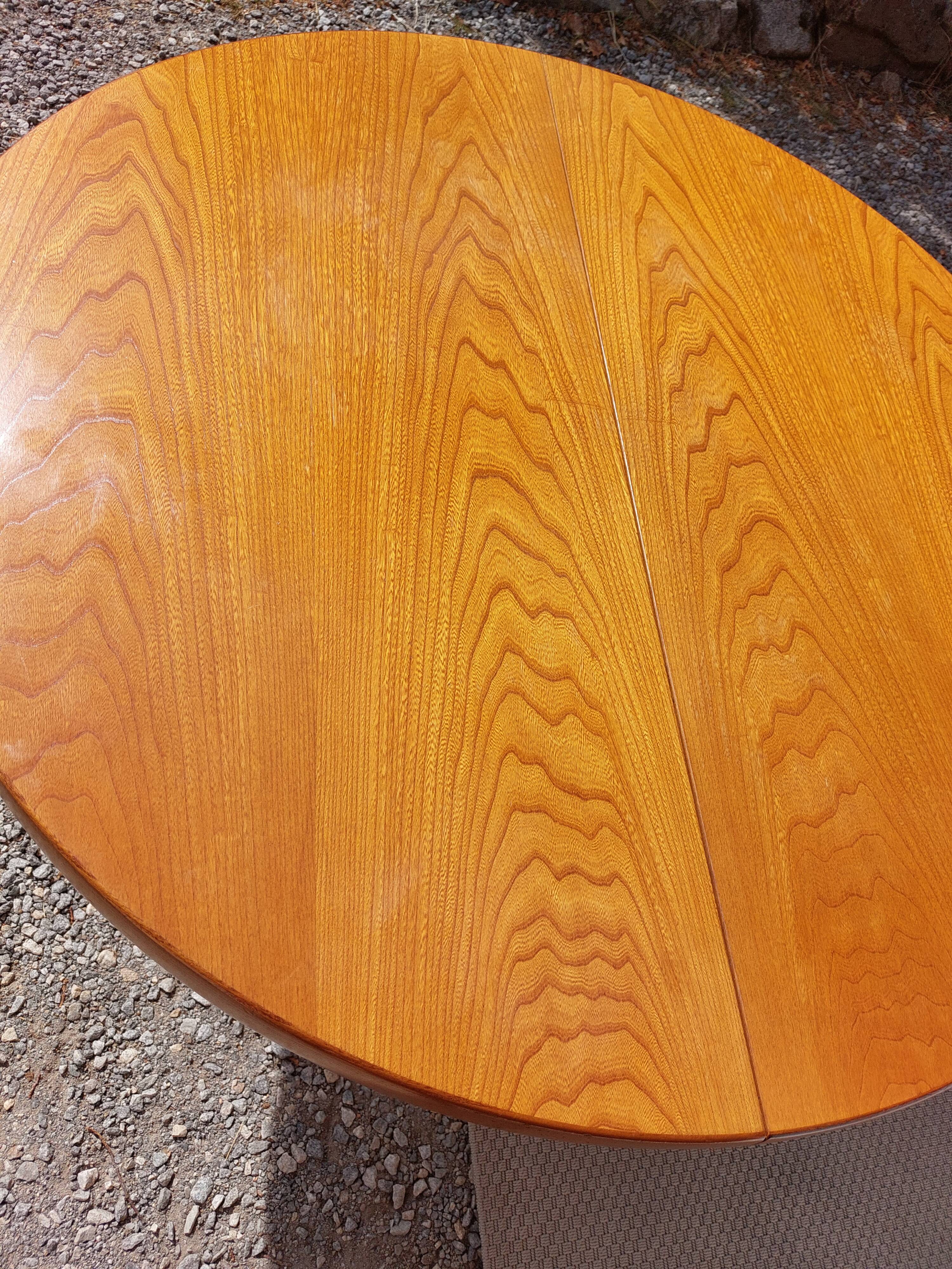 round or oval table with extension, central leg, vintage Baumann design