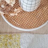 Antique stool with wood and cream caning.