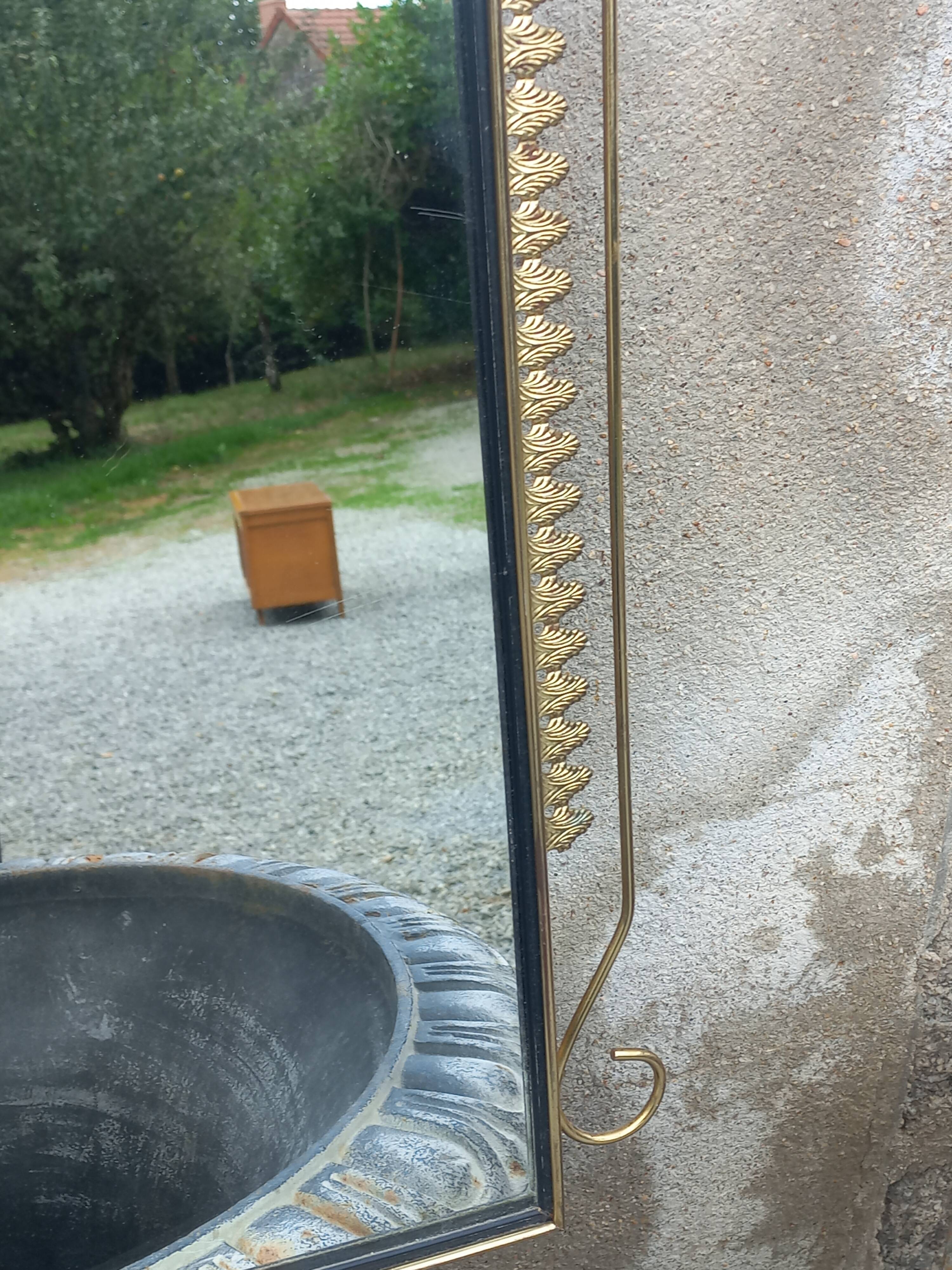 Vintage 1950s neoclassical style gold metal mirror