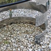 Oval coffee table of the 70s chromed metal base in s smoked glass top